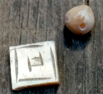 pearl bead and square mother of pearl inlay both found on the same day